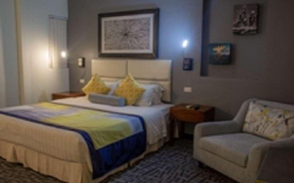 Century Hotel Garapan Pokoj fotografie